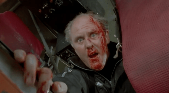 Eric Qualen (John Lithgow) in Cliffhanger (1993) featuring Sylvester Stallone